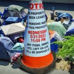 Signs warning of removal of encampment with May 31 deadline have been posted at Burien site