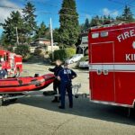 Adult & child rescued from overturned boat by firefighters Sunday