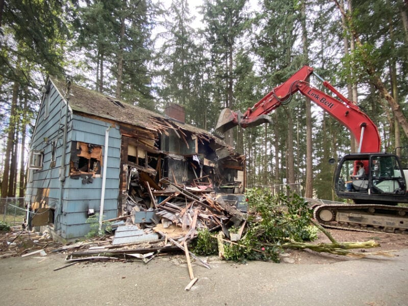PHOTOS: Demolition of burned-out Dottie Harper Park house and garage completed in Burien
